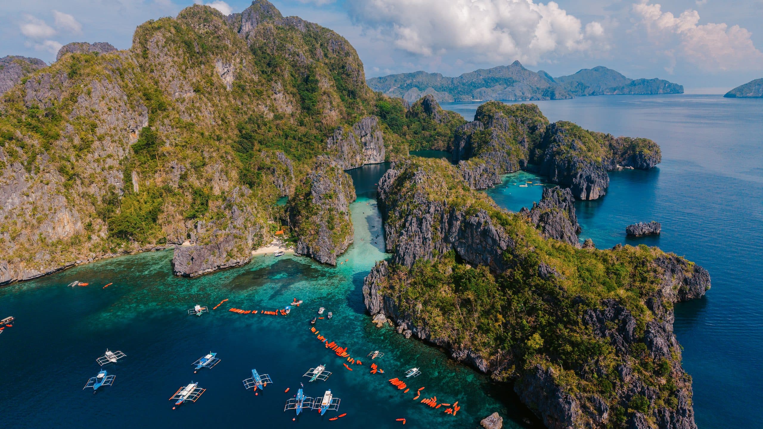 Bangka boats moored at the lagoons of Miniloc Island, El Nido